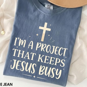 Comfort Colors I'm A Project That Keeps Jesus Busy Shirt, Funny Christian Shirt, Faith Humor Tee, Christian Graphic Shirt
