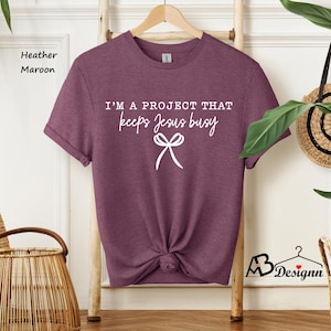Funny Christian Shirt, I'm A Project That Keeps Jesus Busy Shirt, Coquette Christian Shirt, Christian Women Gift, Jesus Tee